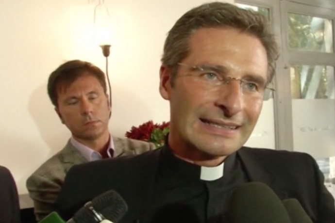 Father Krysztof Charamsa with his partner Eduard at a news conference this past weekend: "I am a gay priest. I am a happy and proud gay priest."