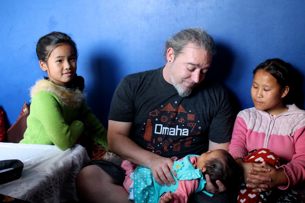 Chris Heuertz visits with some of the younger members of his longtime friends, the Rai family, in Kathmandu on May 1, 2015. Photo by Cathleen Falsani. 