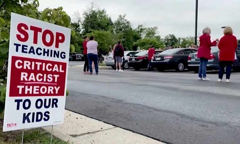 Neighborhood sign reads: Stop Teaching Critical Race Theory To Our Kids.