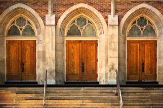 Three church doors in a row, all shut.