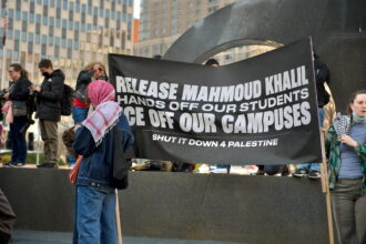 Protests in Thomas Paine Park against the detention of Palestinian activist and Columbia student Mahmoud Khalil. Sign reads "Release Mahmoud Khalil. Hands off our students. ICE off our campuses. Shut it down 4 Palestine."