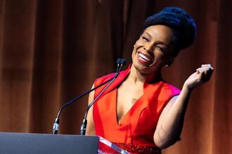 Amber Ruffin strikes a winsome pose as she hosts the Dramatists Guild Foundation gala.