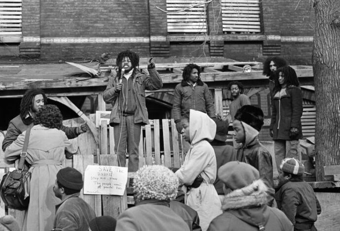 Eddie Africa addressing a crowd in front of MOVE headquarters (March 1978)