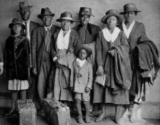 "Scott and Violet Arthur arrive with their family at Chicago's Polk Street Depot on Aug. 30, 1920, two months after their two sons were lynched in Paris, Texas. The picture has become an iconic symbol of the Great Migration. (Chicago History Museum)"