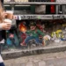 Street art seen in Seattle on Dec. 11, 2024 features the video-game character Luigi carrying a backpack with the logo of insurance company UnitedHealthcare crossed out, an apparent celebration of Luigi Mangione, the man accused of killing company CEO Brian Thompson. (David Ryder/Reuters - image credit)